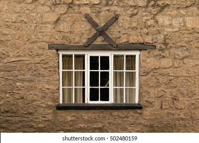 old stone wall with window