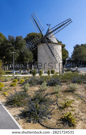 Old stone windmill standing on a sunny day in Lambesc, Bouches du Rhone, France