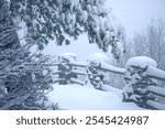 Old stone and wooden fence overlooking a frozen valley