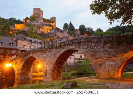Old stony bridge dated 15th century over Aveyron river. Les Plus Beaux Villages de France (Most beautiful villages of France). Belcastel. Aveyron. France