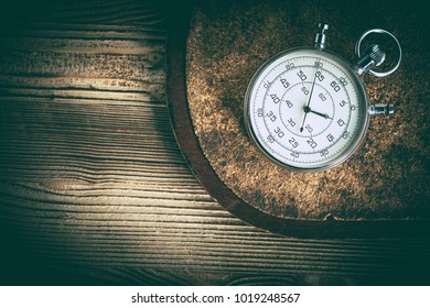 An old stopwatch on a cork background. Vintage style. - Shutterstock ID 1019248567