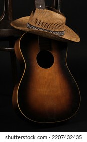 Old Straw Hat, Guitar And Chair