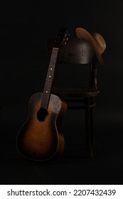 Old Straw Hat, Guitar And Chair