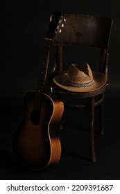 Old Straw Hat, Guitar And Chair