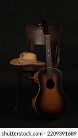 Old Straw Hat, Guitar And Chair