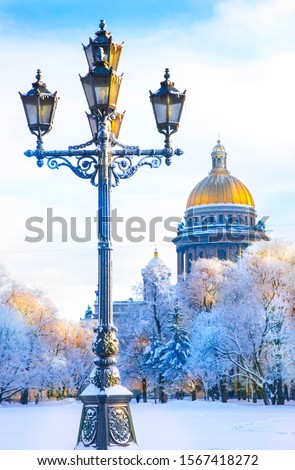 Old street lantern, snow, Isaak Cathedral as background