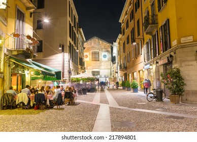 Old Street In Milan At Night, Italy. Architecture And Landmarks Of Milan. Nightlife Of Milan  