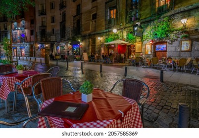 Old Street With Table Of Restaurant In Madrid, Spain. Architecture And Landmark Of Madrid. Night Cityscape Of Madrid.