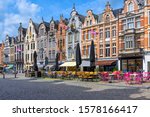 Old street with tables of cafe in Mechelen, Belgium. Mechelen is a city and municipality in the province of Antwerp, Flanders, Belgium.