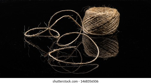 Old String On A Black Shinny Floor