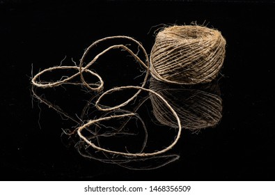 Old String On A Black Shinny Floor