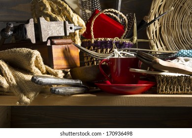 Old stuff piled on a wooden shelf in the larder and waiting for his connoisseur