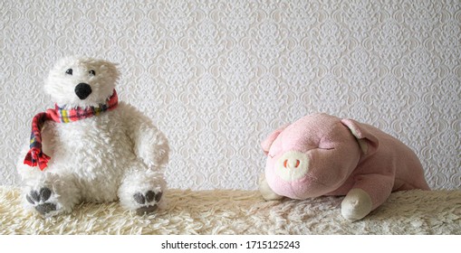 An Old Stuffed Polar Bear On The Sofa.