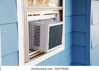 Old Style Air Conditioner Installed On Window