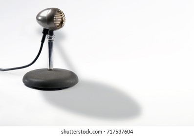 Old style antique microphone with room for your type.