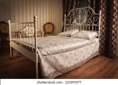 Old Style Bed In The Elegant Bedroom