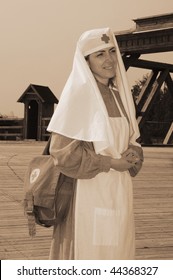 Old Style Picture With Woman In Nurse Costume. Costume Is Authentic To The Ones Weared In Time Of  World War I.