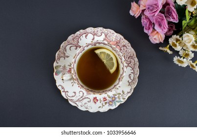 Old Style Rustic, Vintage Tea Cup Top View, With Lemon And Flowers