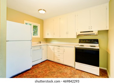 Old Style Simple Kitchen Interior With Cabinets And White Appliances. Northwest, USA