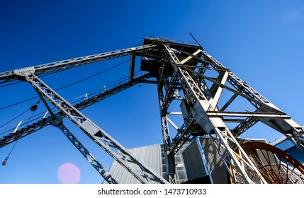 Old style steel lattice headgear mine shaft pulley wheel in South Africa
