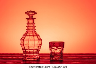 Old Style Vintage Whiskey Decanter And A Glass On Wooden Table