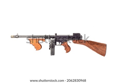 Old submachine gun of the Thompson system isolated on white background.