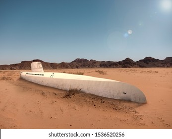 An old submarine is stuck in the sand of the desert