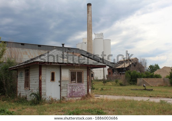 Old sugar beet factory\
abandoned.  Derelict building in Loveland, CO.  Condemned factory\
in shambles.