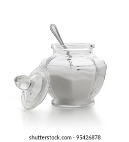 An Old Sugar Bowl With Spoon On White Background