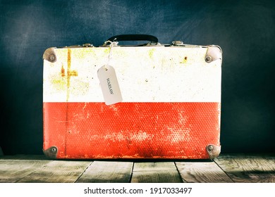 Old suitcase with the Poland flag on wooden background. Travels - Shutterstock ID 1917033497