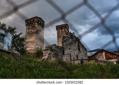 Old Svan tower. The view through the mesh . In the historical region of Georgia - Svaneti. The Town Of Mestia