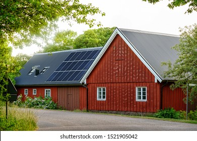Old Swedish House With Solar Panel Roof In Country Side