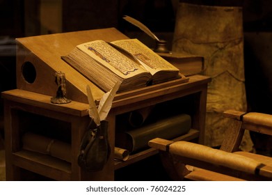 Old Table With The Ancient Book. Vintage