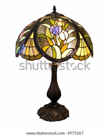 An old table lamp with decorative glass shade