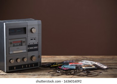 Old Tape Recorder And Cassette On  Wooden Table