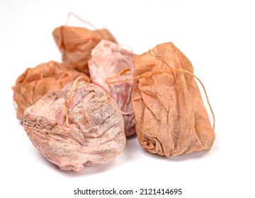 Old tea bags against white background
