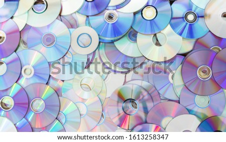 Old technology, waste compact disc collection decoration for pattern. cd background concept.