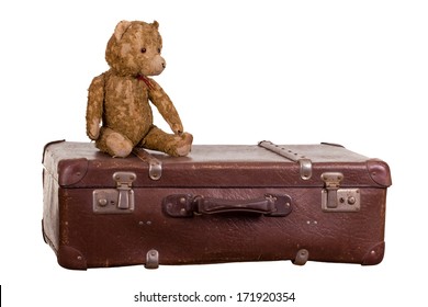 Old Teddybear Sitting On Suitcase