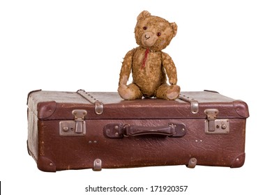 Old Teddybear Sitting On Suitcase