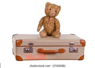 Old Teddybear Sitting On Suitcase