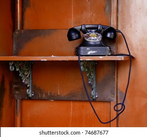 Old telephone on red wall ,798, china