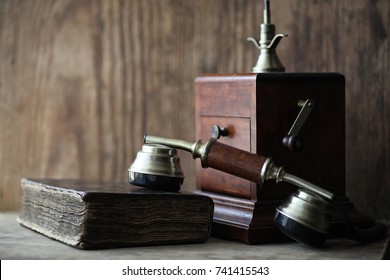 Old Telephone And Retro Book On A Wooden Table
