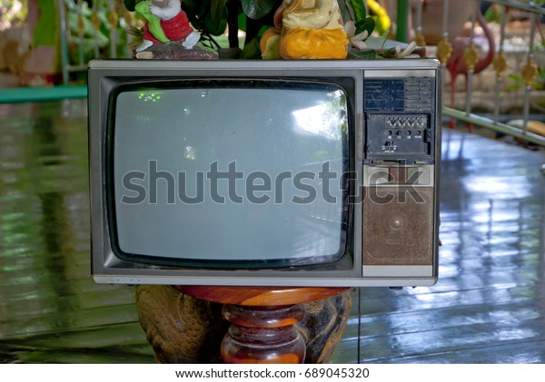 Old television,\
Old television in Thailand