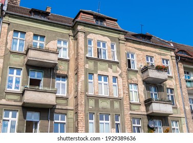 Old Tenement Houses On A Background Of Blue Sky