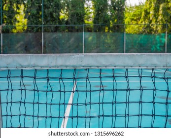 Old Tennis Net And Old Tennis Court. Close Up To Tennis Net.