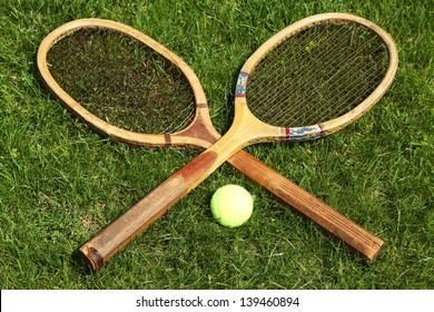 Old tennis rackets on grass court