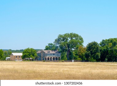 Old Texas Ranch House With Large Field In Front