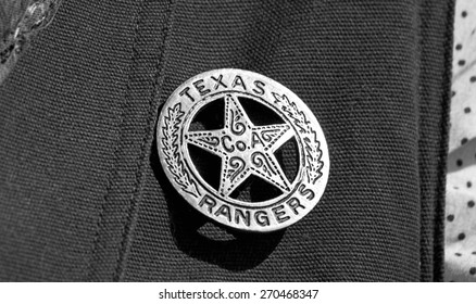 Old Texas ranger cowboy badge in black and white.