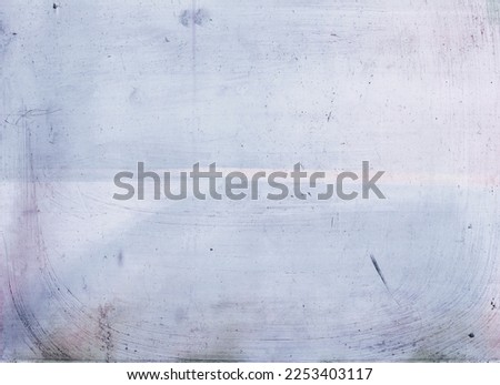 Old texture overlay. Dust scratches noise. Weathered effect. Black white grain stain defect on light blue uneven grunge abstract copy space background.