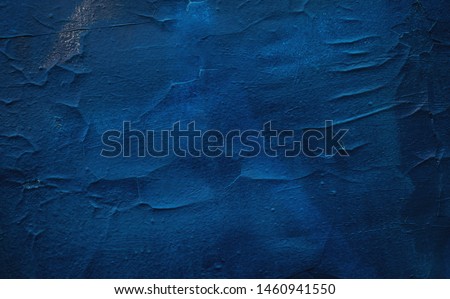 Old textured iron door painted in deep blue color